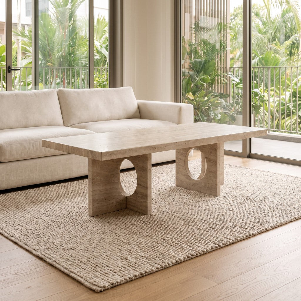Cut-Out Leg White Travertine Coffee Table in a living room