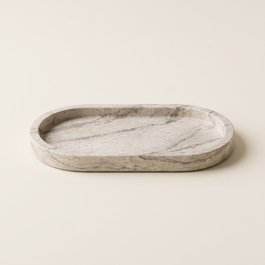 Deep-Rim Oval Tray in Beige Travertine, studio view