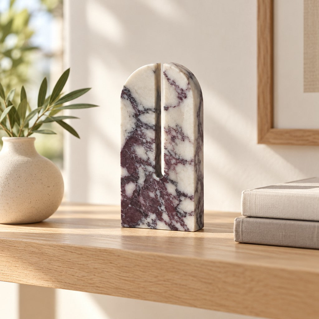 Large Arched Stone Ornament on a wooden shelf