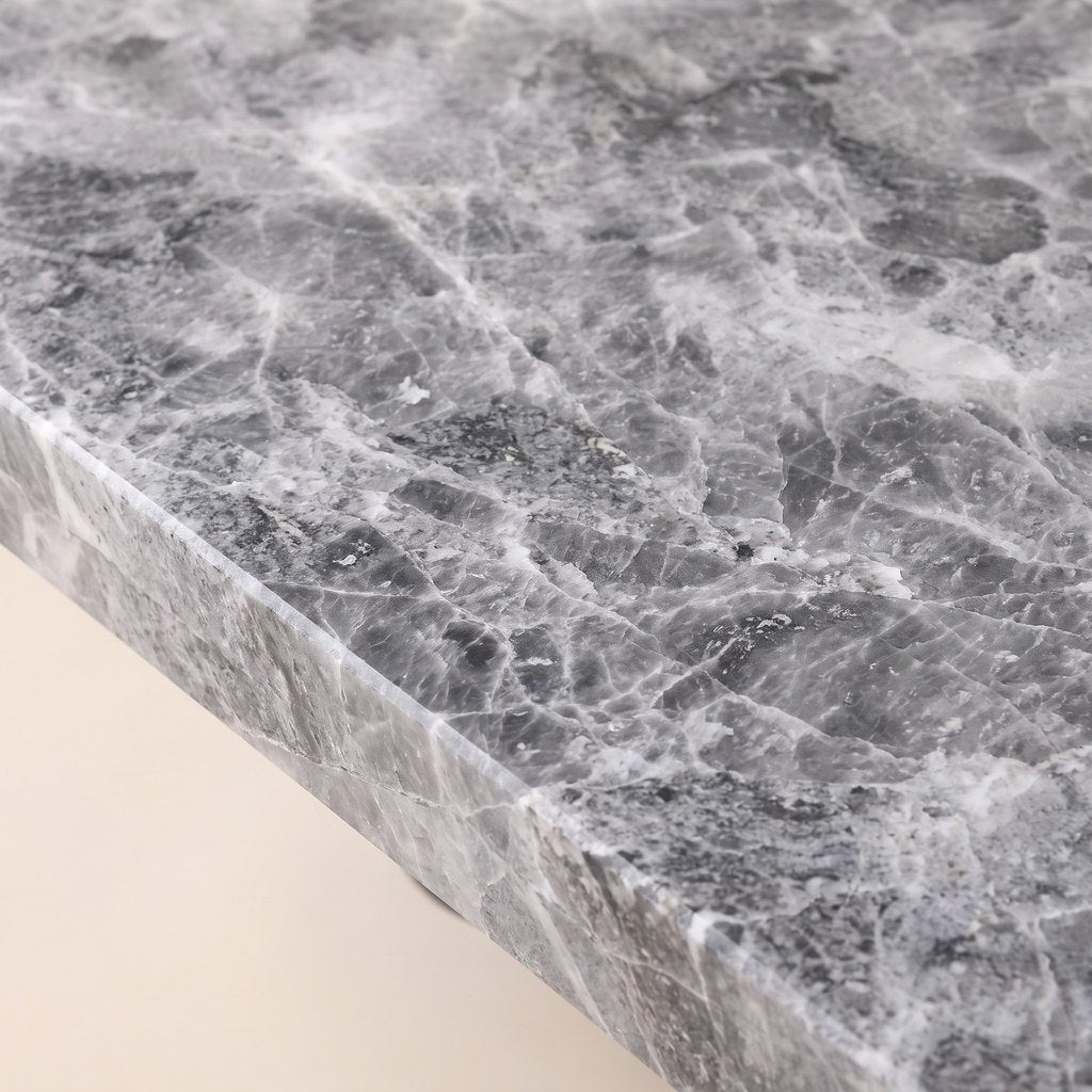 Metal-Leg Rectangular Grey Stone Dining Table: close-up of the grey veined stone surface