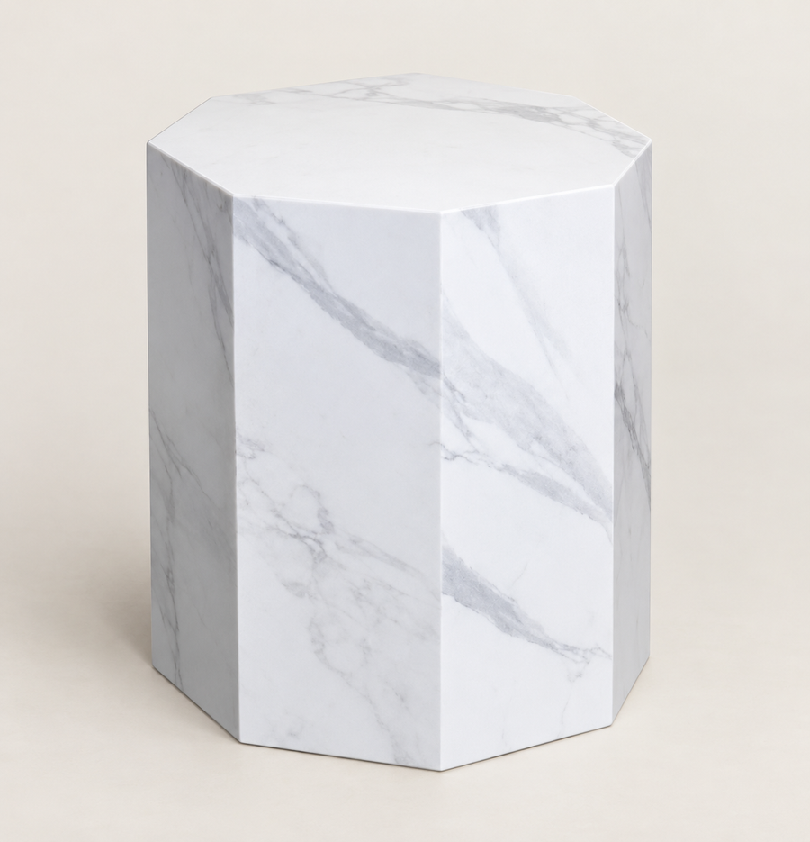 Faceted sintered stone side table in white with grey veining, studio packshot view