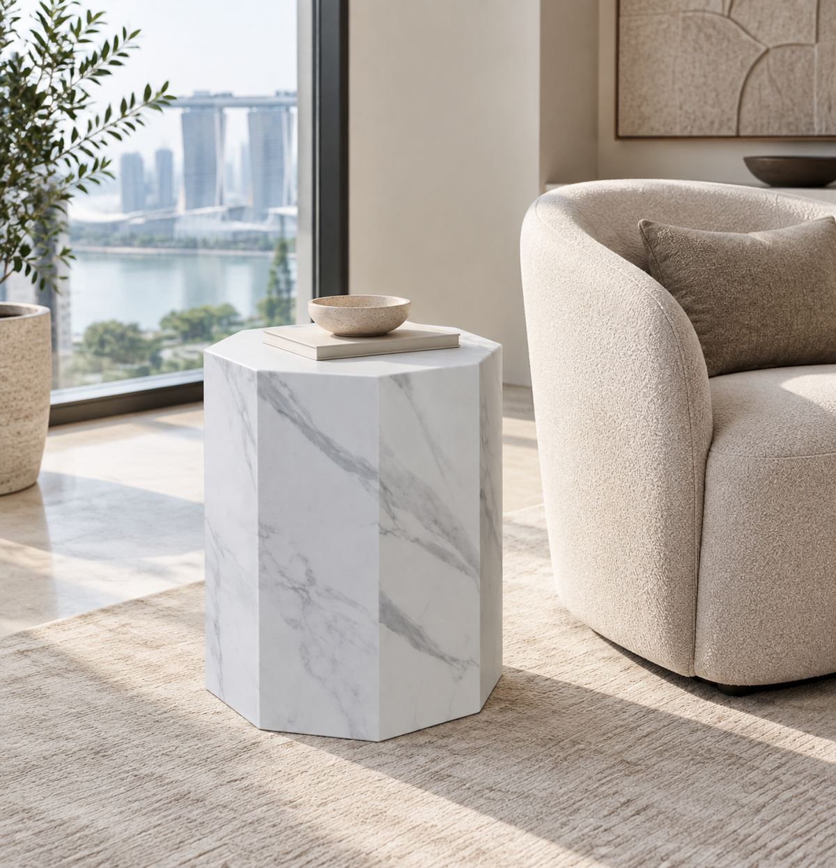 Faceted sintered stone side table in white with grey veining in a contemporary Singapore interior
