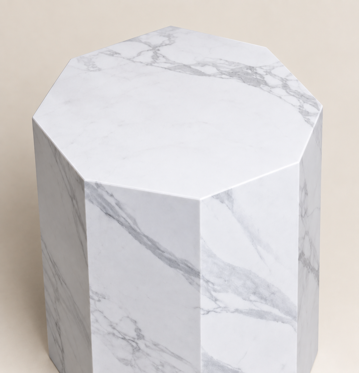 Faceted sintered stone side table in white with grey veining, close top and edge detail