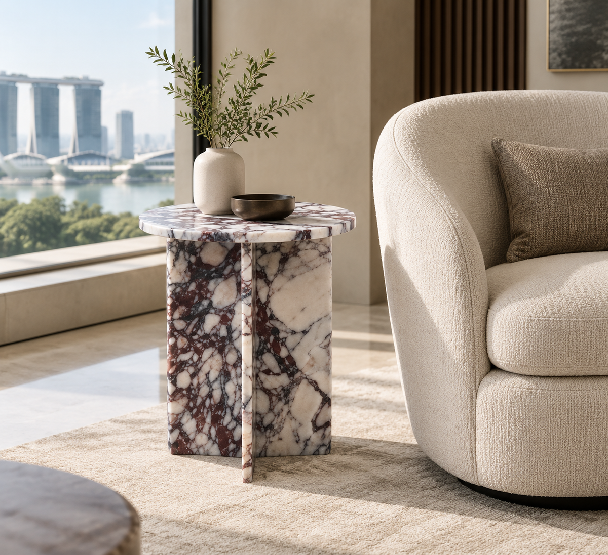Round Drum Side Table in Calacatta Viola — styled Singapore interior view beside a neutral armchair.