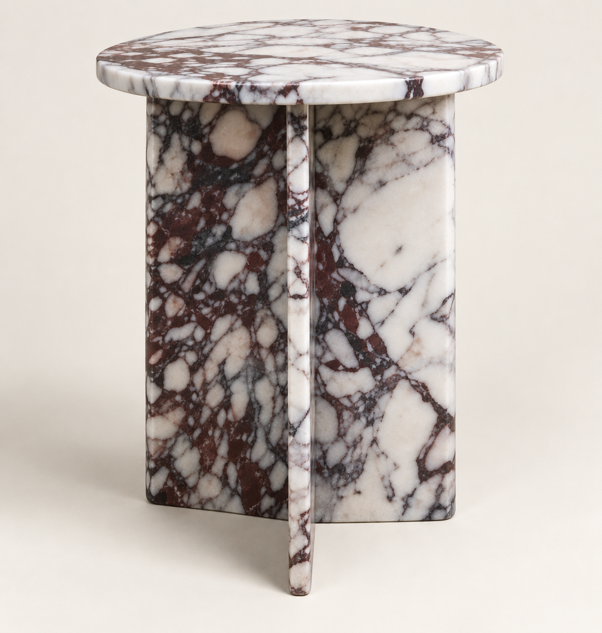 Round Drum Side Table in Calacatta Viola — low three-quarter studio structure view.