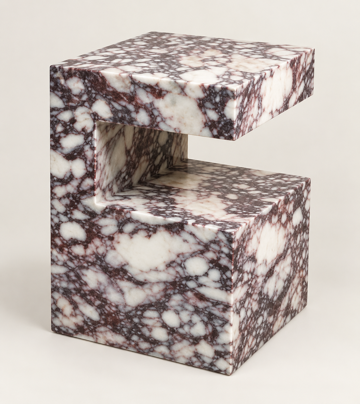 C-Frame Stone Side Table in Calacatta Viola — studio packshot, three-quarter view.