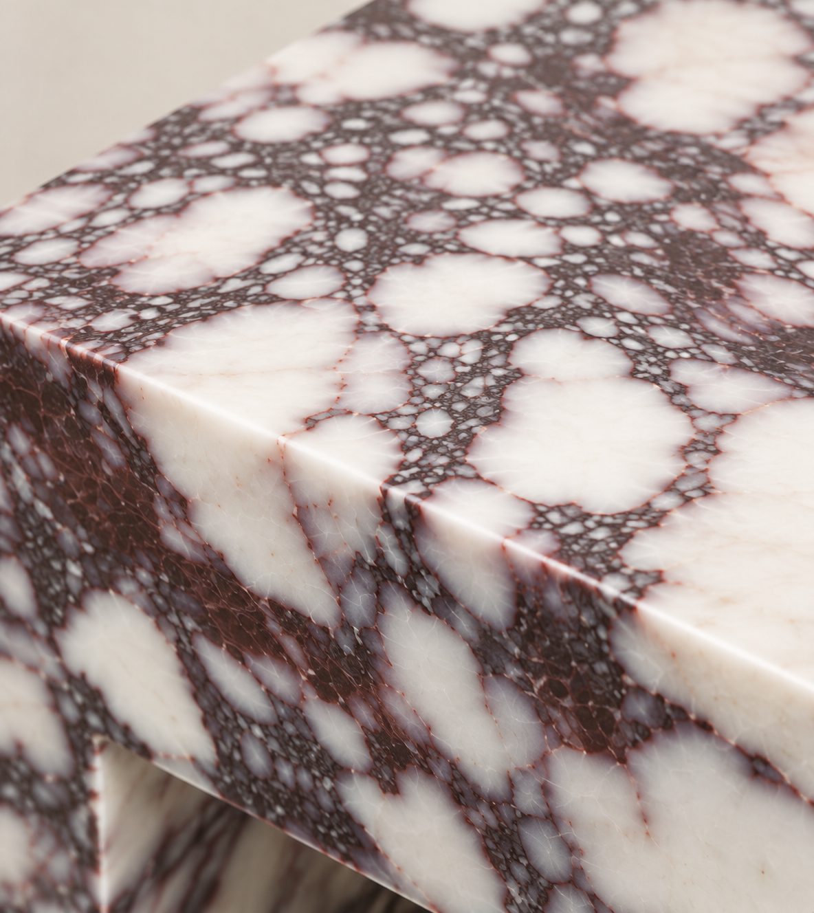 C-Frame Stone Side Table in Calacatta Viola — macro detail of the marble top and edge.