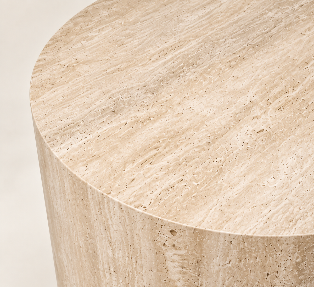 Smooth Drum Travertine Side Table in beige travertine, close top and edge detail.