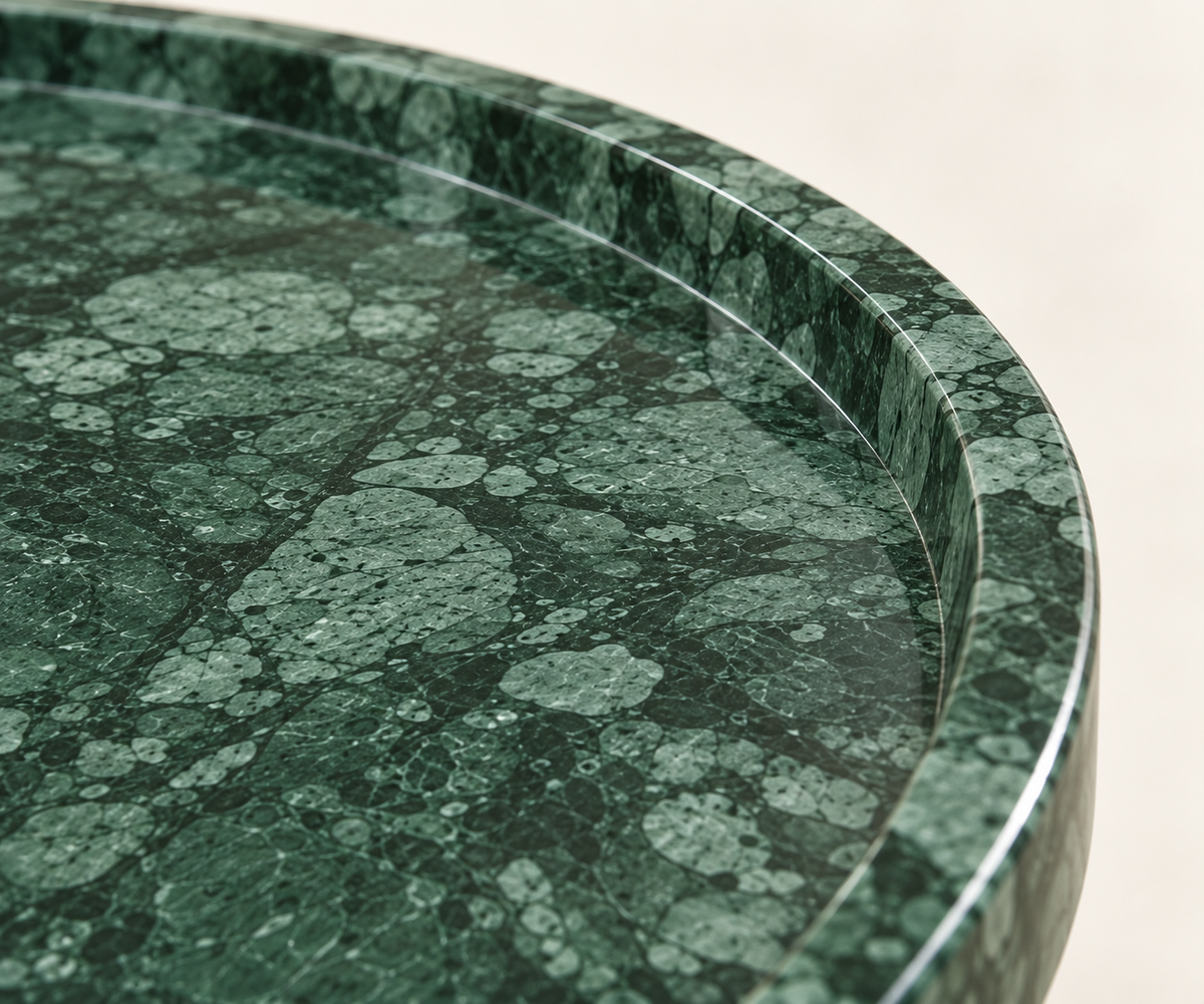 FSF-071 Verde Guatemala marble macro showing the polished tabletop edge and raised rim.