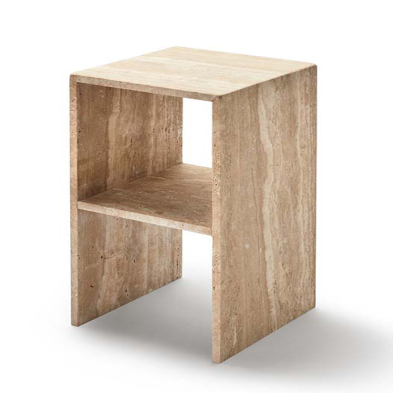 Square beige stone side table with an open shelf and slab sides, three-quarter view