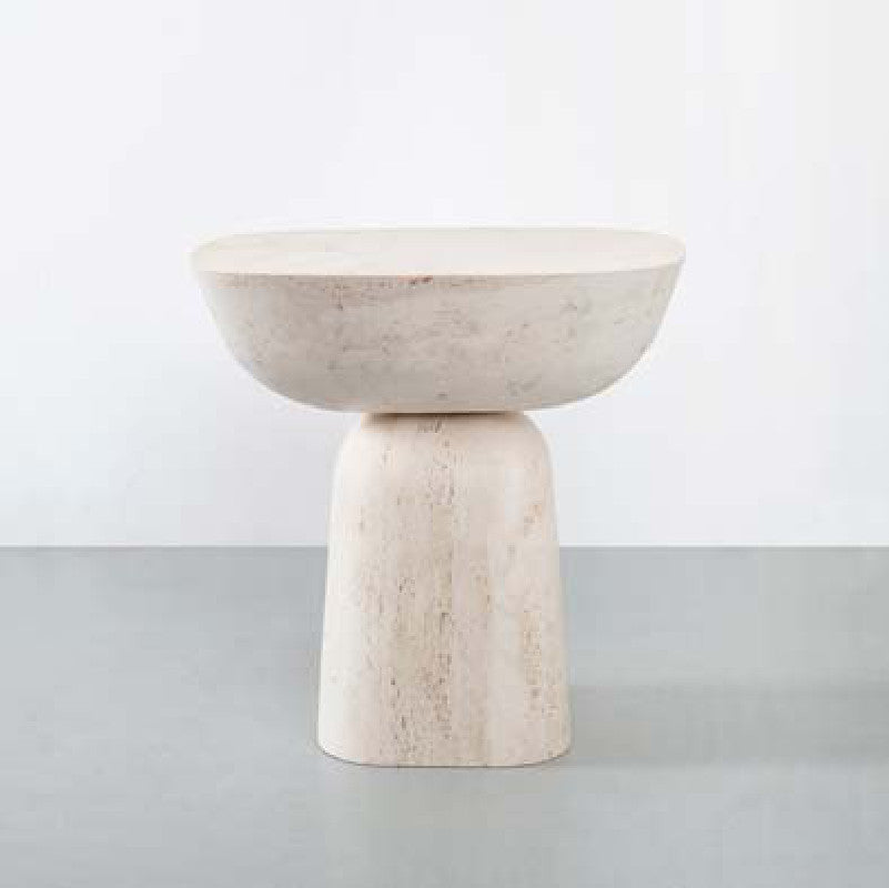 Pale stone side table with a bowl-shaped top and a tapered cylindrical pedestal