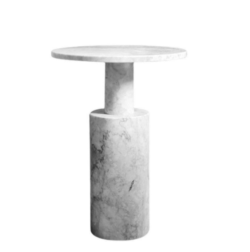 Pale stone side table with a thin round top and offset stepped cylindrical pedestal