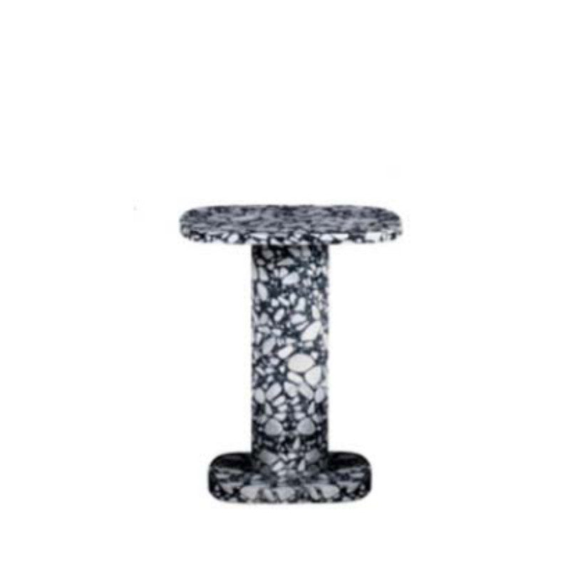 Black and white patterned stone side table with a round top, slim stem and circular foot