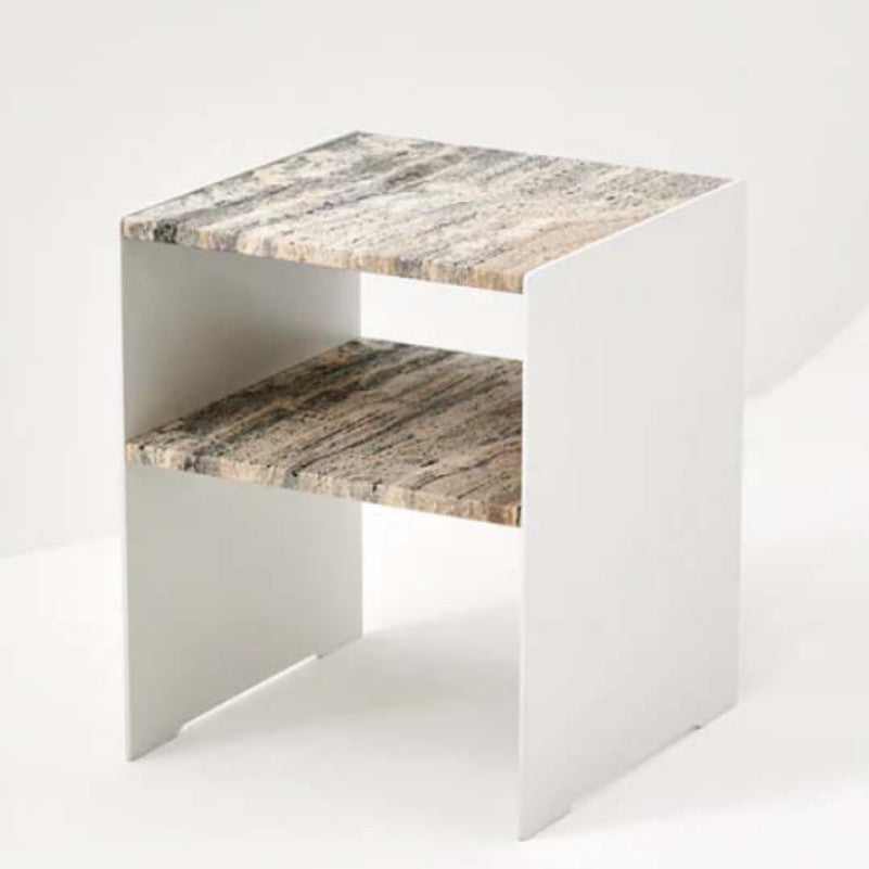 Side table with patterned stone top and lower shelf between two pale slab sides