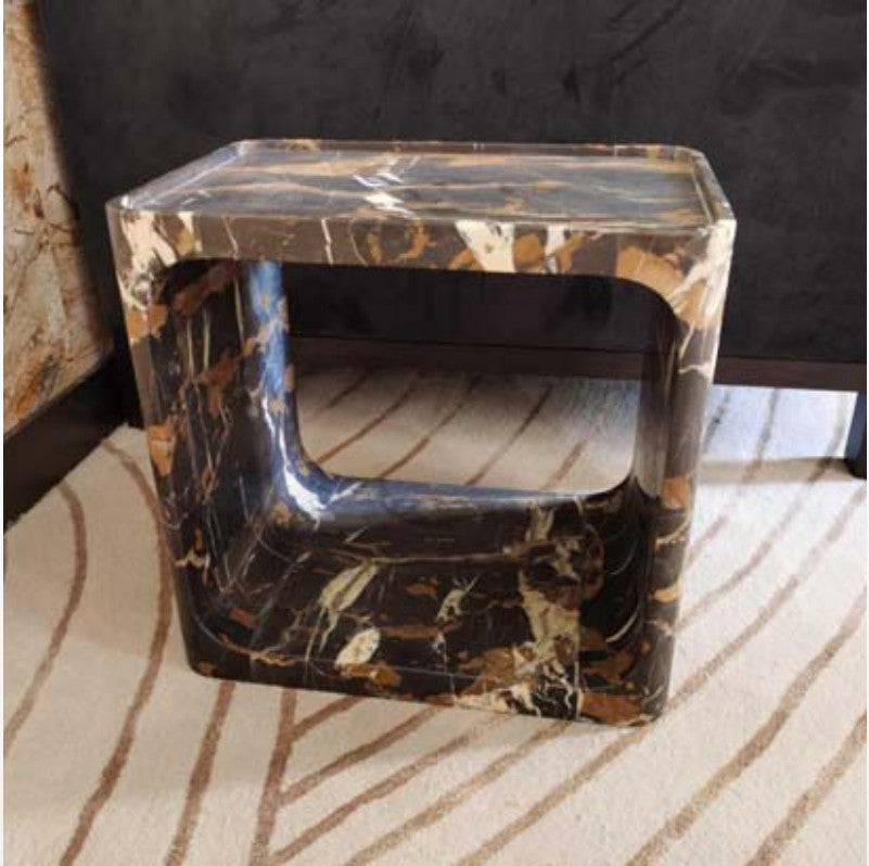 Brown and gold-patterned stone side table with a rounded rectangular frame and recessed top