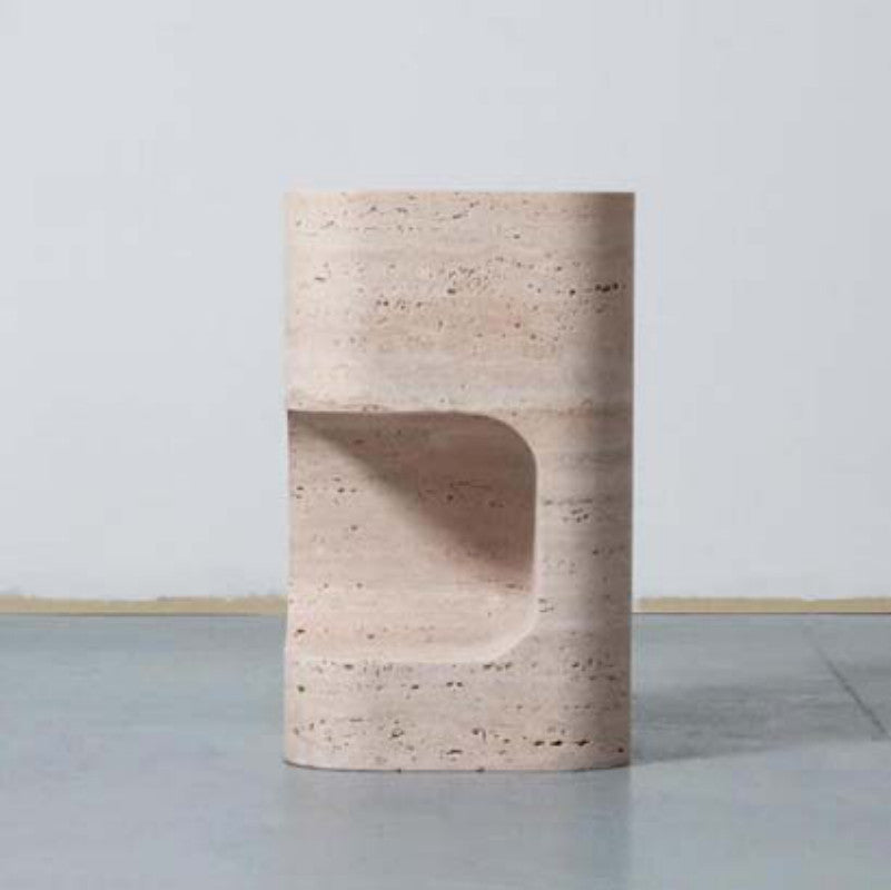 Beige banded stone side table with a cylindrical body and deep curved cut-out