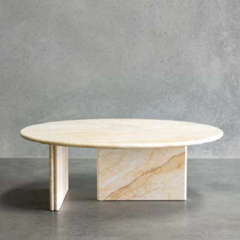 Cream and gold-veined stone coffee table with an oval top and angled slab supports
