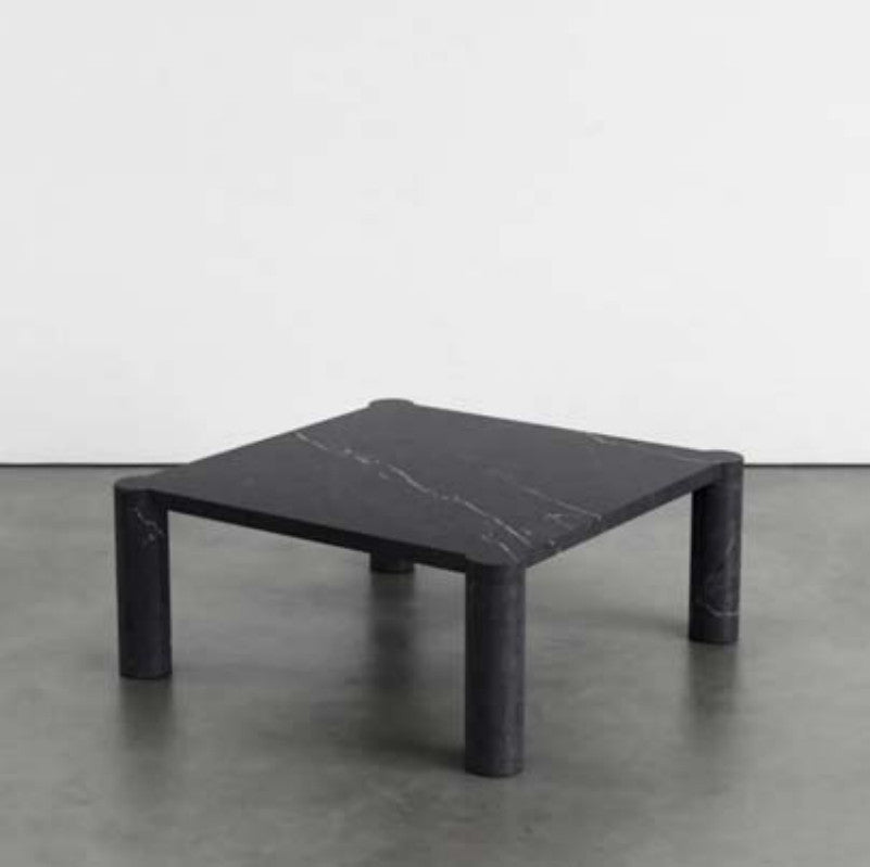 Black veined stone coffee table with a square top and four cylindrical legs