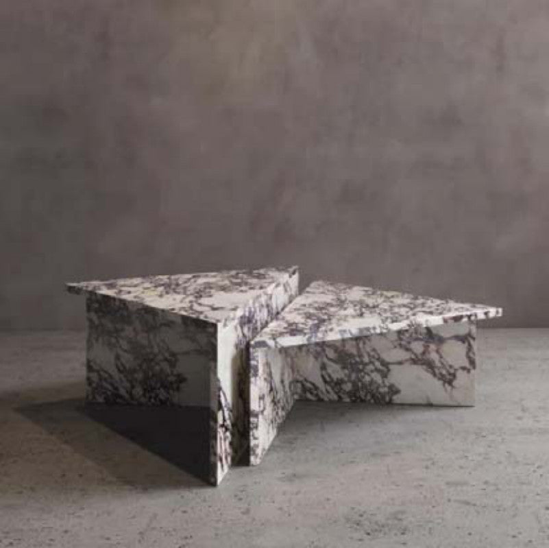 White and purple-veined stone coffee table with a square outline and intersecting angular sections
