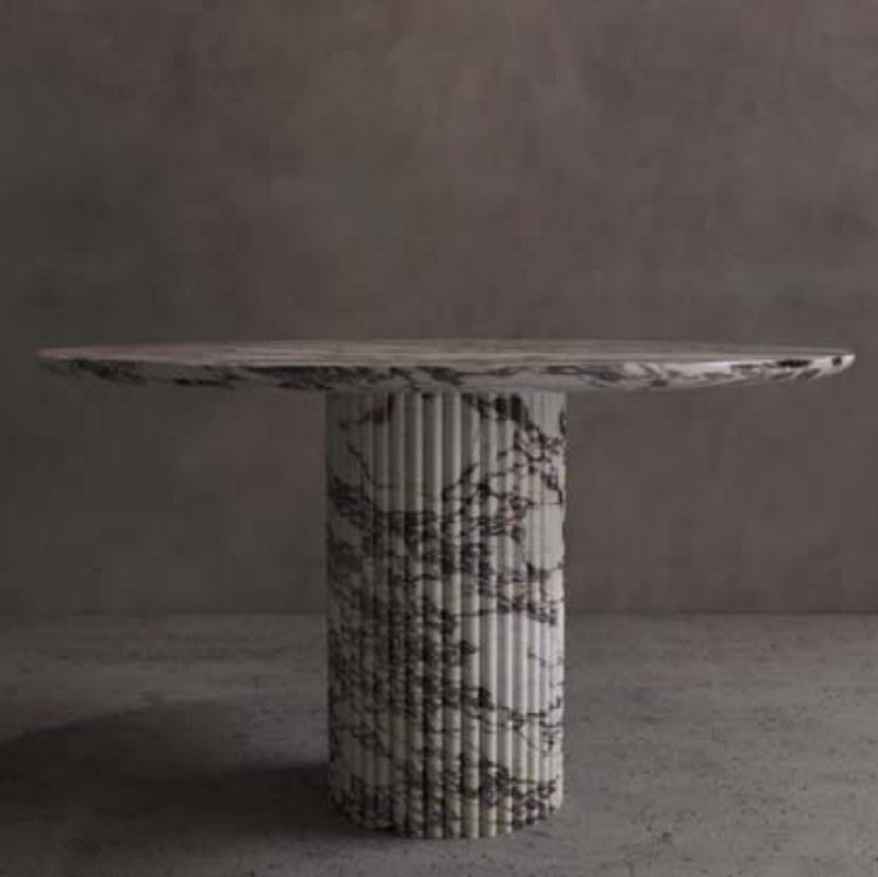 White and dark-veined stone console with an oval top and fluted cylindrical pedestal
