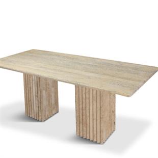 Rectangular beige stone dining table with two fluted slab supports, three-quarter view