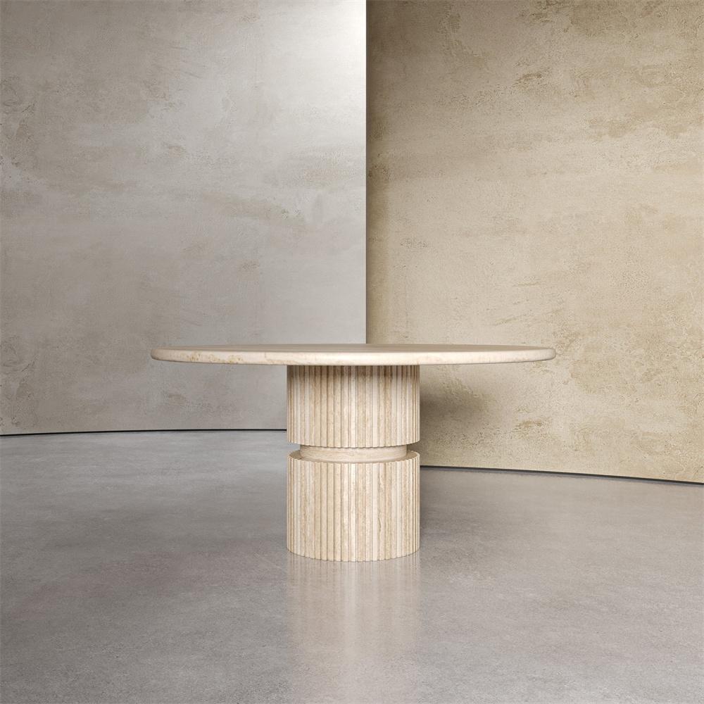 Round pale stone dining table with a fluted cylindrical pedestal and central band, front view