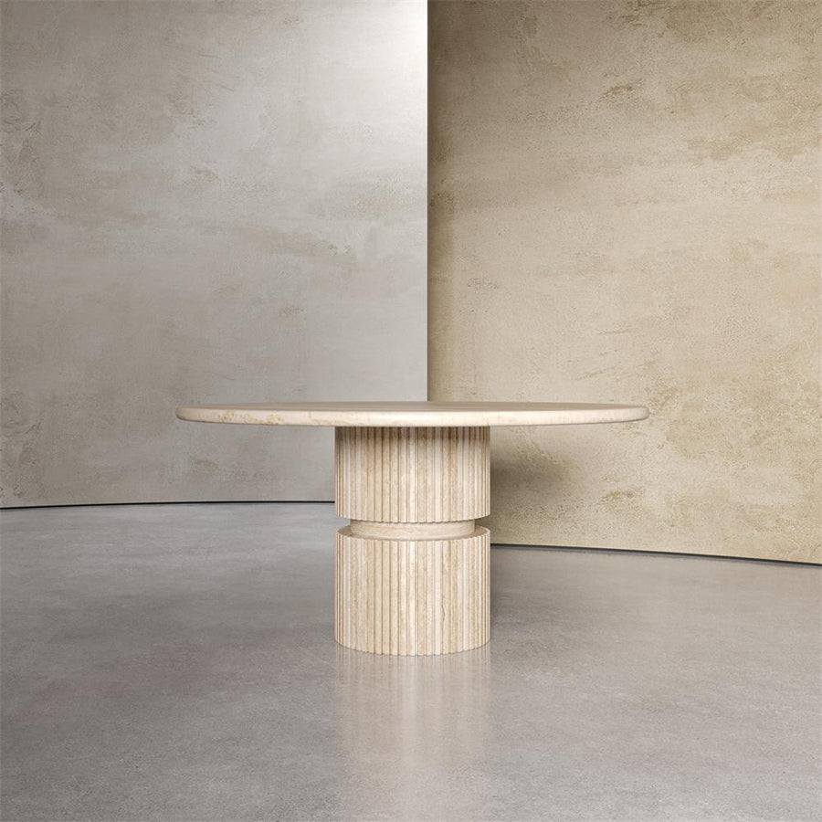Round pale stone dining table with a fluted cylindrical pedestal and central band, front view