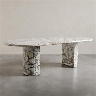 Oval veined stone dining table with two cylindrical supports, front view