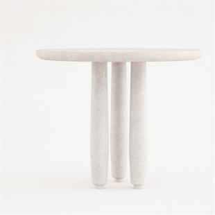 Pale stone dining table with clustered cylindrical legs, front view