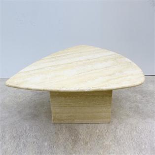 Pale yellow veined stone coffee table with a rounded triangular top and a block base