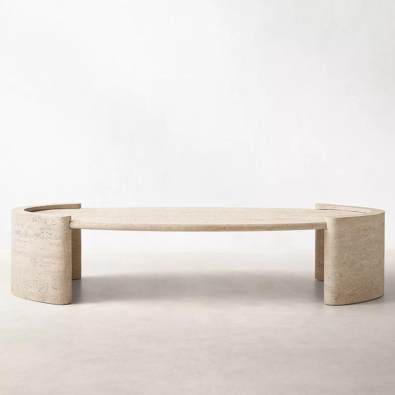 Oval pale stone coffee table with curved end supports, front view