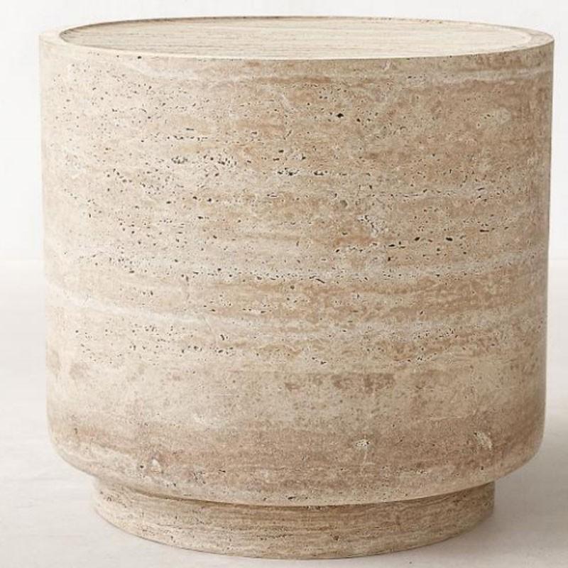 Round beige stone drum side table with a recessed base, front view