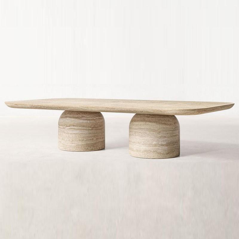 Pale stone coffee table with a thin elongated top and two rounded supports, front view
