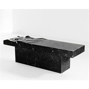 Rectangular dark veined stone table with a thick slab top and broad base, three-quarter view