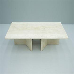 Rectangular pale stone coffee table with intersecting slab supports, three-quarter view