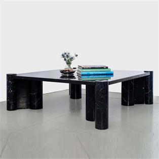 Square dark stone coffee table with clustered cylindrical legs, three-quarter view