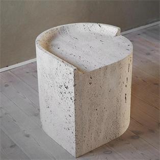 Pale stone side table with a curved outer wall and recessed top, viewed from above