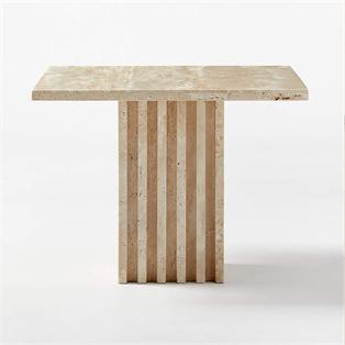 Pale stone side table with a flat top and striped slab pedestal, front view