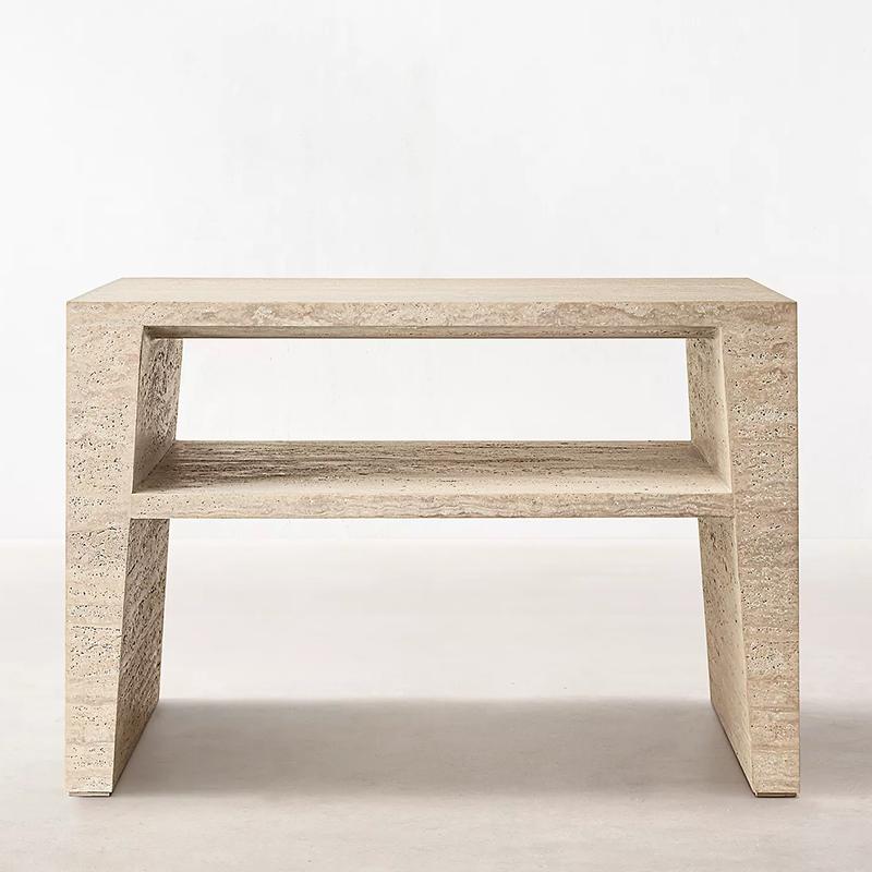 Rectangular pale stone side table with an open shelf and slab legs, front view