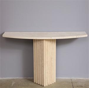 Pale stone console with a curved top and fluted central pedestal