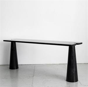 Long black stone console with a thin rectangular top and two tapered legs