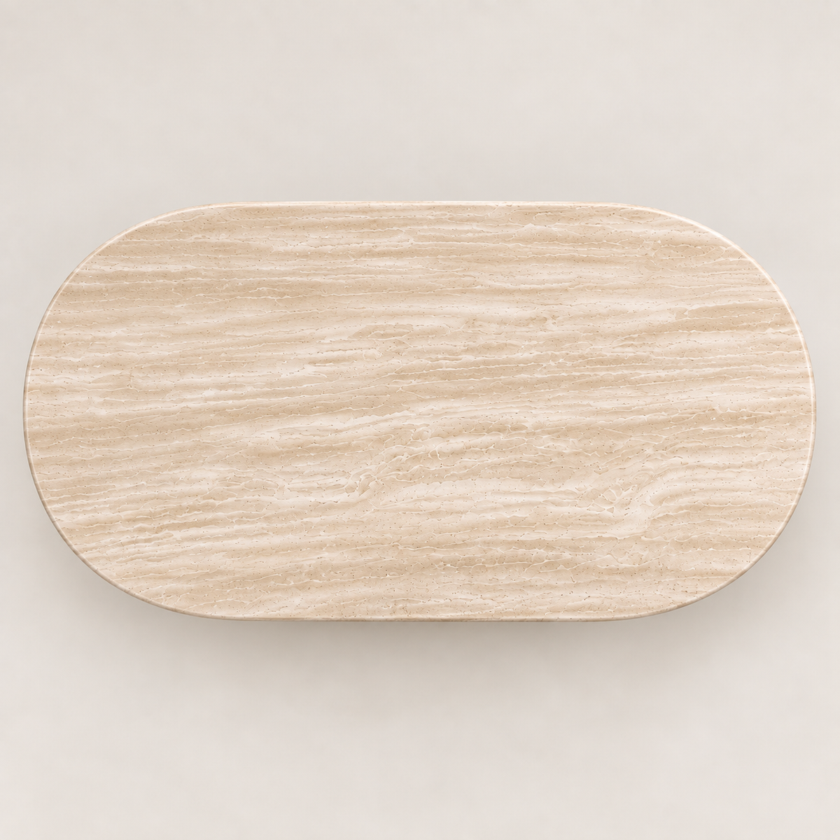 Top view of the oval Light Beige Travertine dining table top showing its natural longitudinal stone pattern.