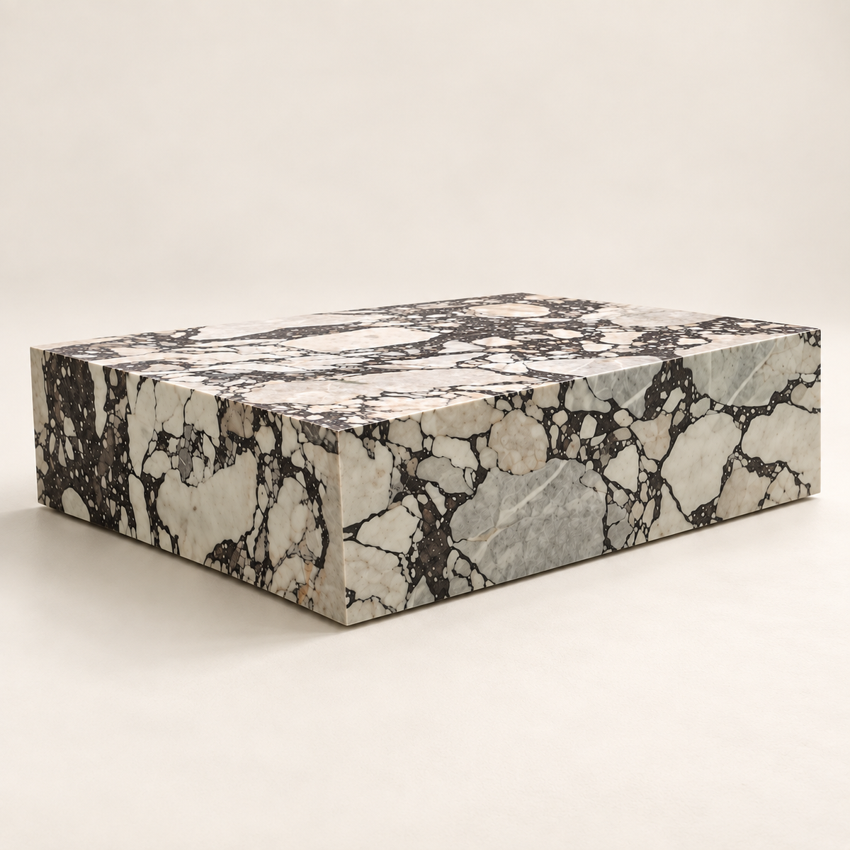 Viola Plinth MS-02 marble coffee table from a low studio angle showing the long face and side.