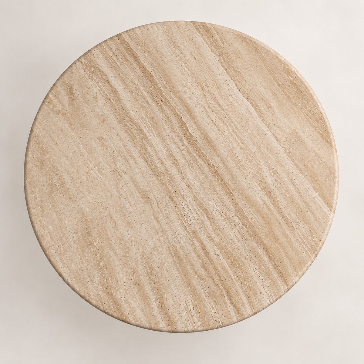 Round light beige travertine dining table top, vertical overhead studio view