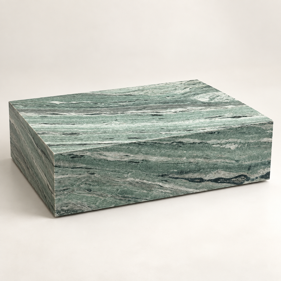 Shangri La Green Plinth Coffee Table in an ivory studio, three-quarter view.
