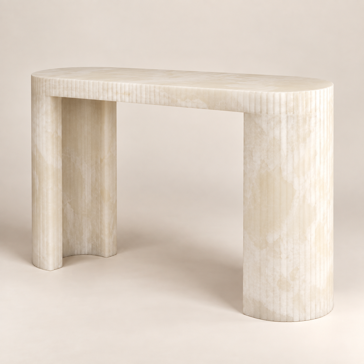 White Onyx Console Table in a low front three-quarter studio view showing the open curved supports.
