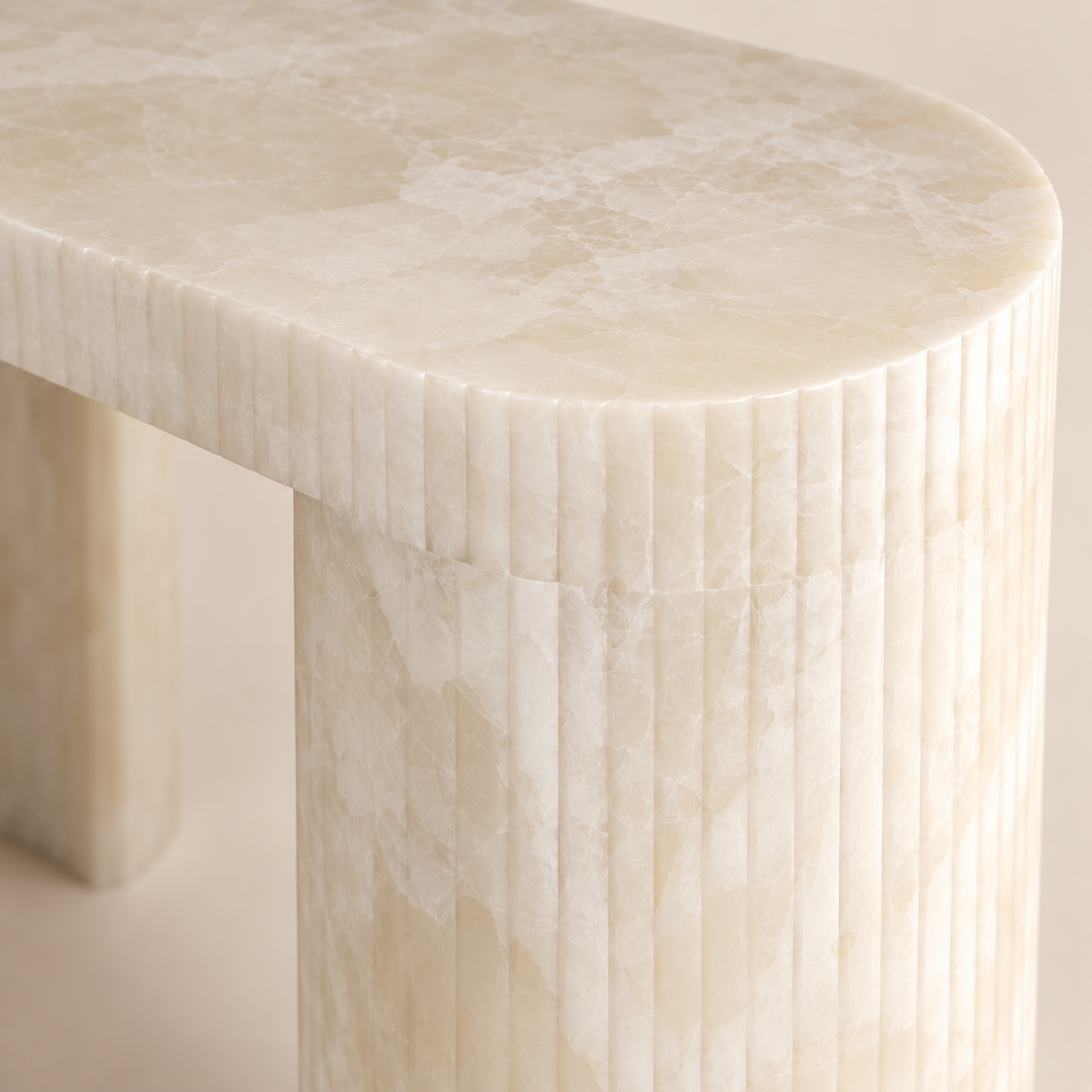 Close-up of the White Onyx Console Table showing the rounded edge and fine vertical fluting.