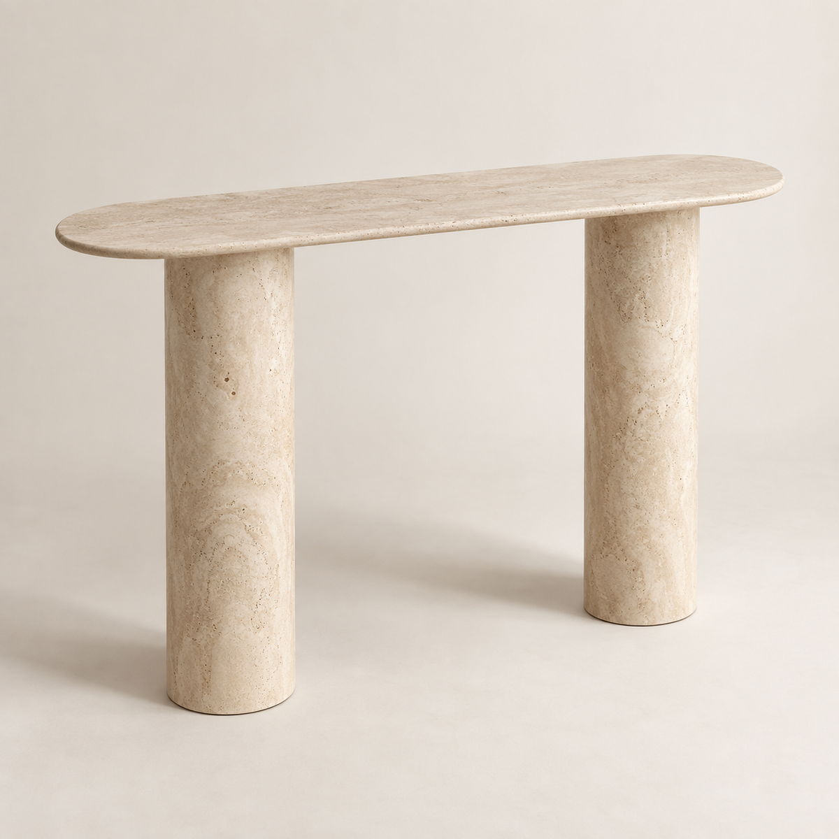 White Beige Travertine Console Table in an ivory studio, three-quarter view showing the slim rounded top and two smooth cylindrical supports.