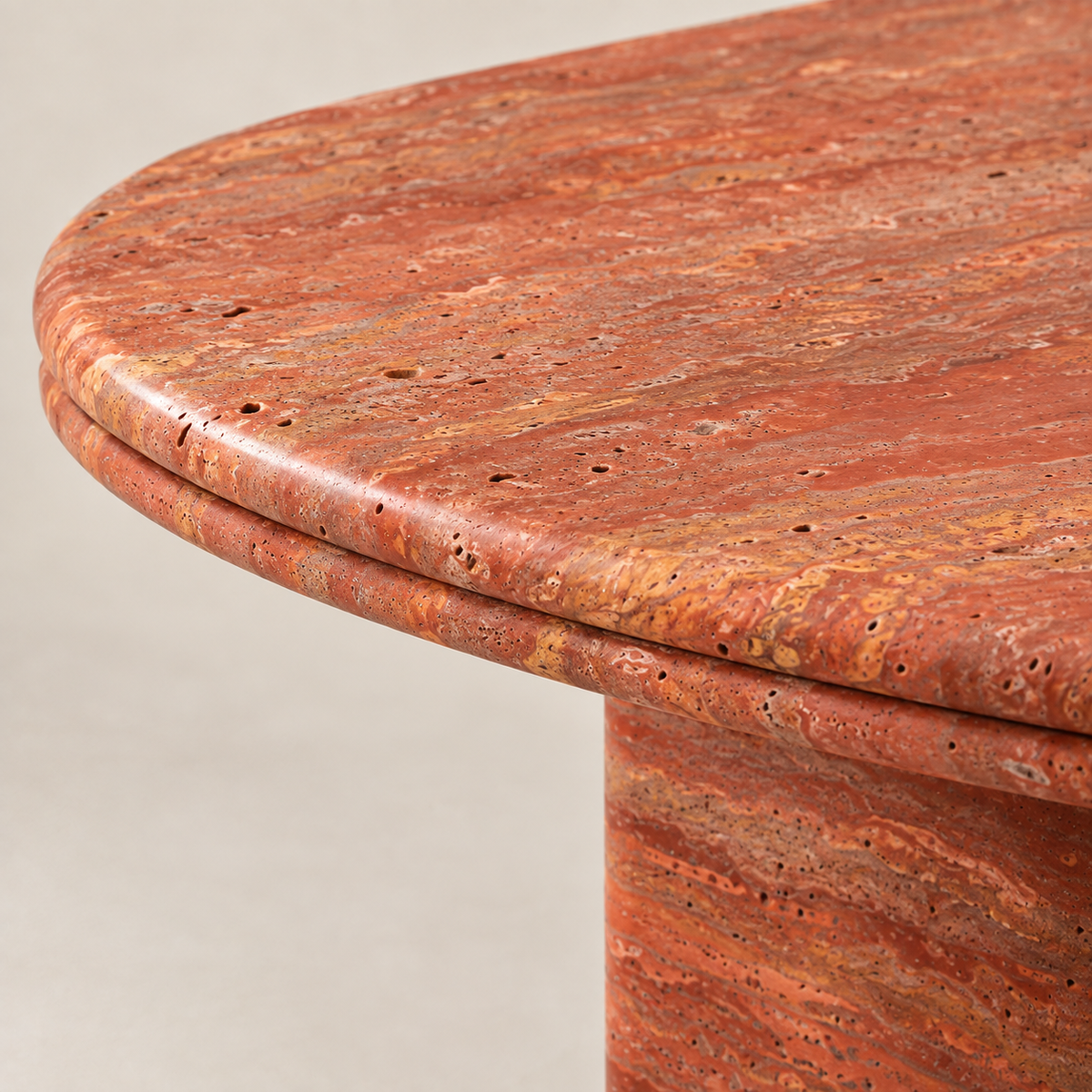 Red Travertine Dining Table MS-12, close-up detail of the rounded tabletop edge and red travertine finish.