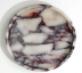 Round cream and dark veined stone tray, viewed from above